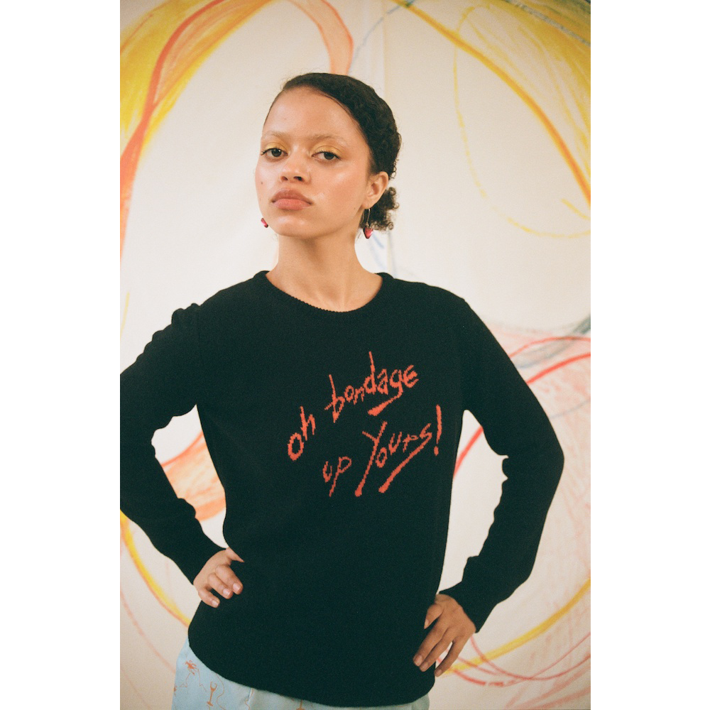 Model wearing the 'Oh Bondage, Up Yours!' jumper in Black and orange