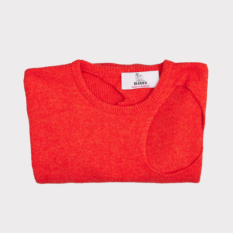 Folded flat shot of the Sélavy jumper in orange