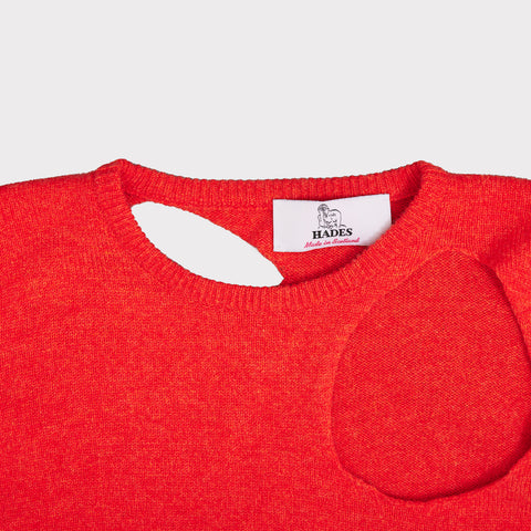 Close up flat shot of the Sélavy jumper in orange