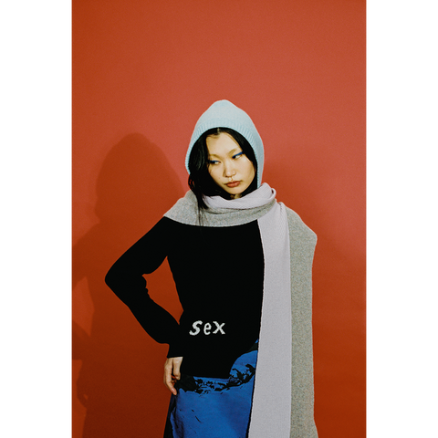 Model wearing the HADES the arctic blue, lilac and light grey hooded scarf