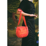Model carrying the "Let Things Shake" bag.