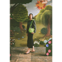 Model with the "Make Friends With Chaos" bag standing in front of a faux garden of eden.