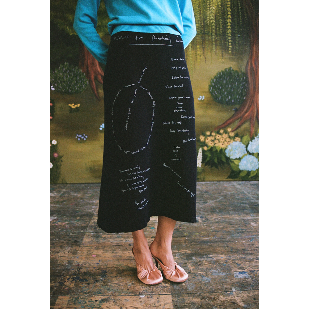 Model wearing the "Notes for Radical Living" skirt.