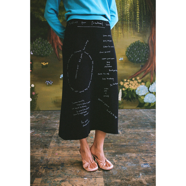 Model wearing the "Notes for Radical Living" skirt.