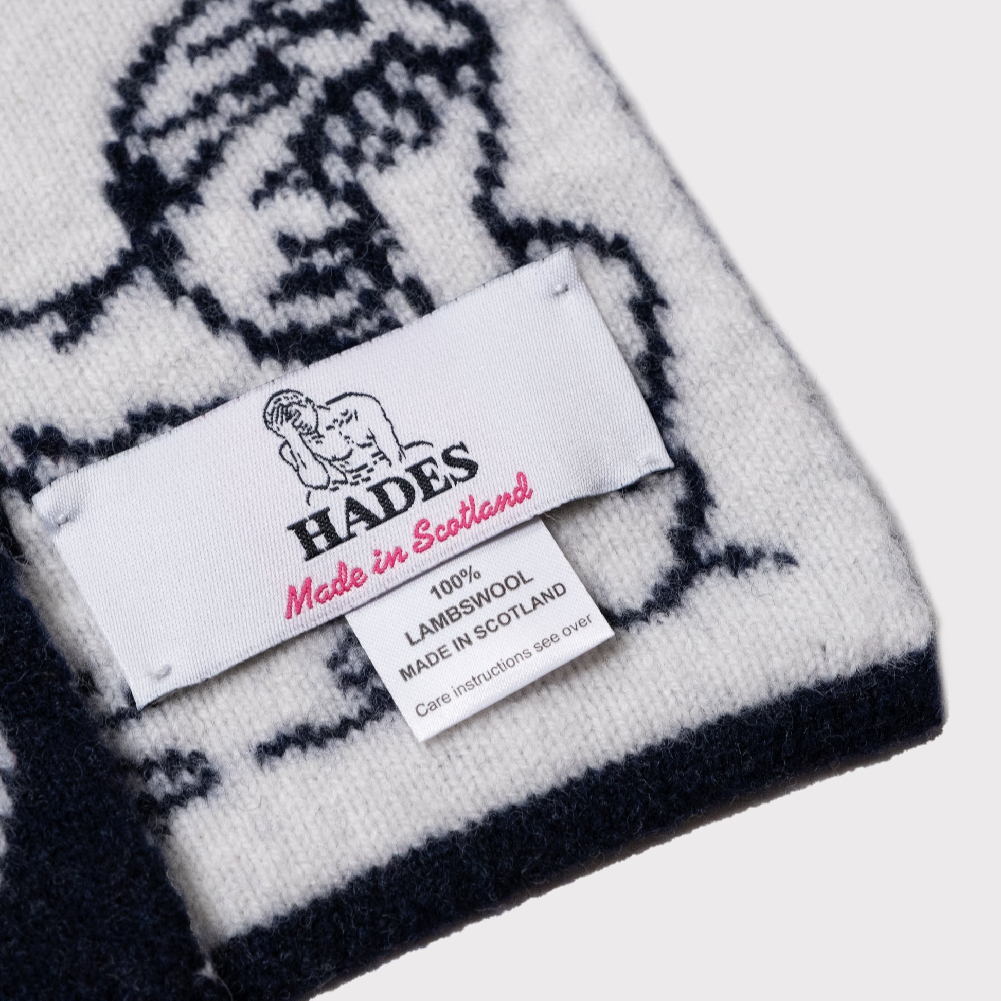 Flatshot detail image of the label on the HADES Logo Scarf.