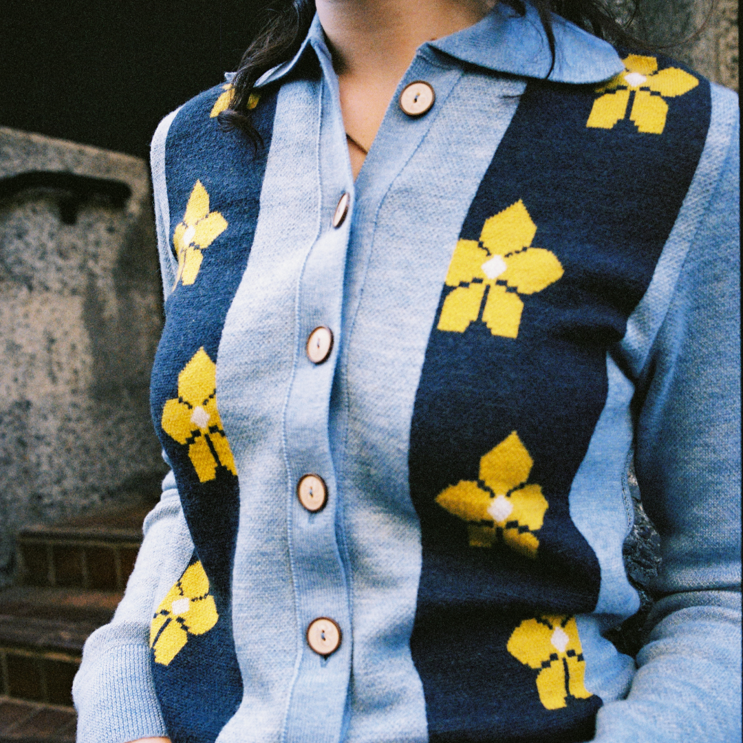 Model wearing blue floral Barbauld cardigan.